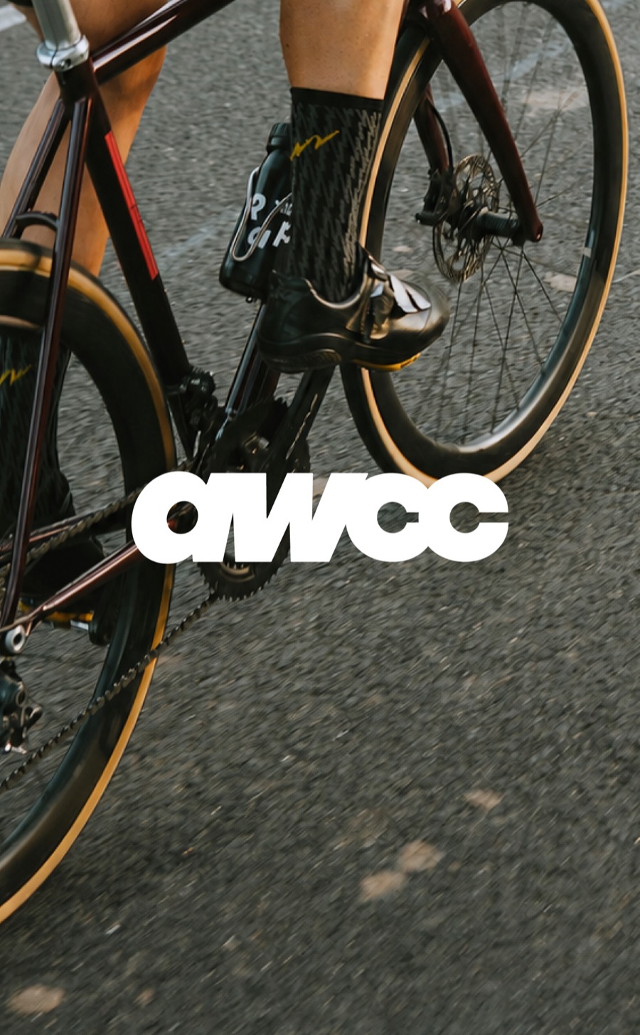 Road cyclist with the AWCC mark across the frame