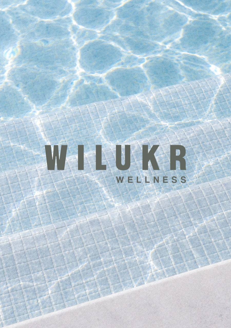 Wilukr Wellness branding over sunlit pool steps