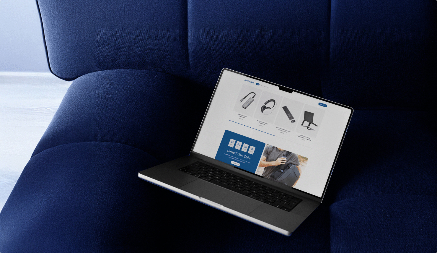 Laptop showing the Bonelk online store propped against deep blue upholstery