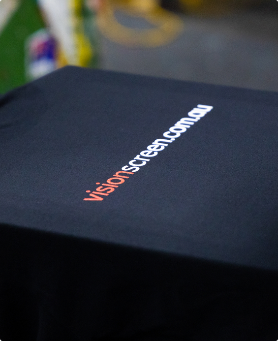 Black t-shirt screen printed with the visionscreen.com.au web address