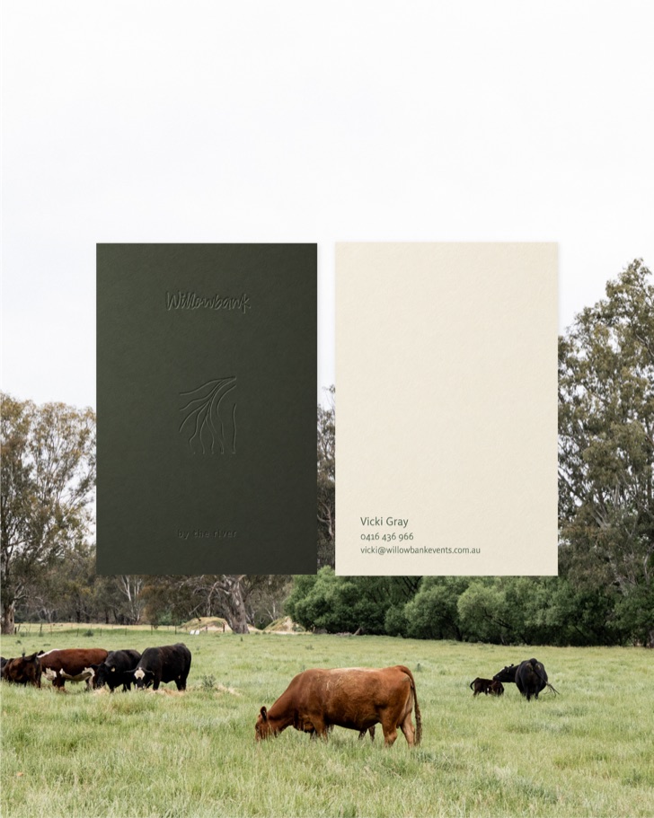Embossed deep green Willowbank card and cream contact card set over cattle grazing among river gums