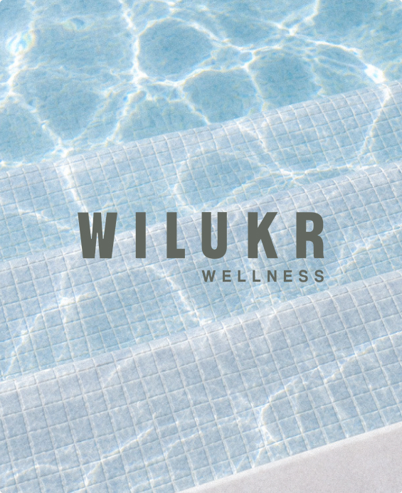 Wilukr Wellness brand lockup set over rippling pool water
